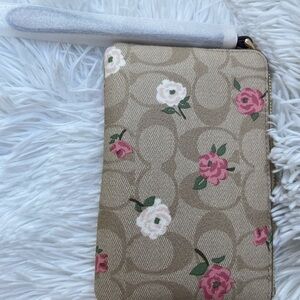 Coach Tan Wristlet with Pink and White Floral Design